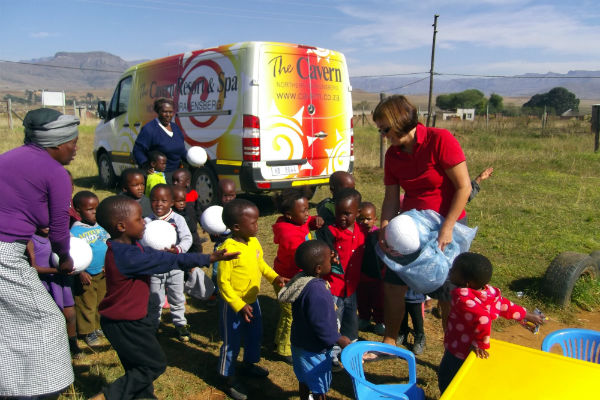 Daphne giving out some balls at Emseni school